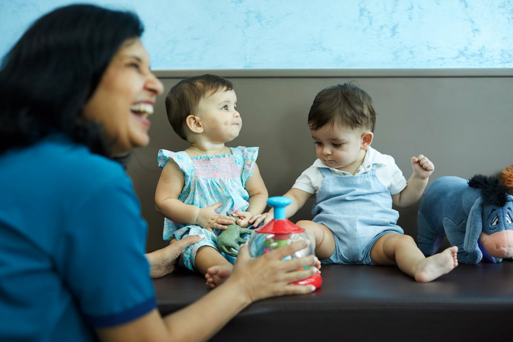 Dr shivani paliwal child health paediatrician playing with children at IMC Childrens clinic